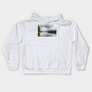 Cloudy sky over calm lake Kids Hoodie